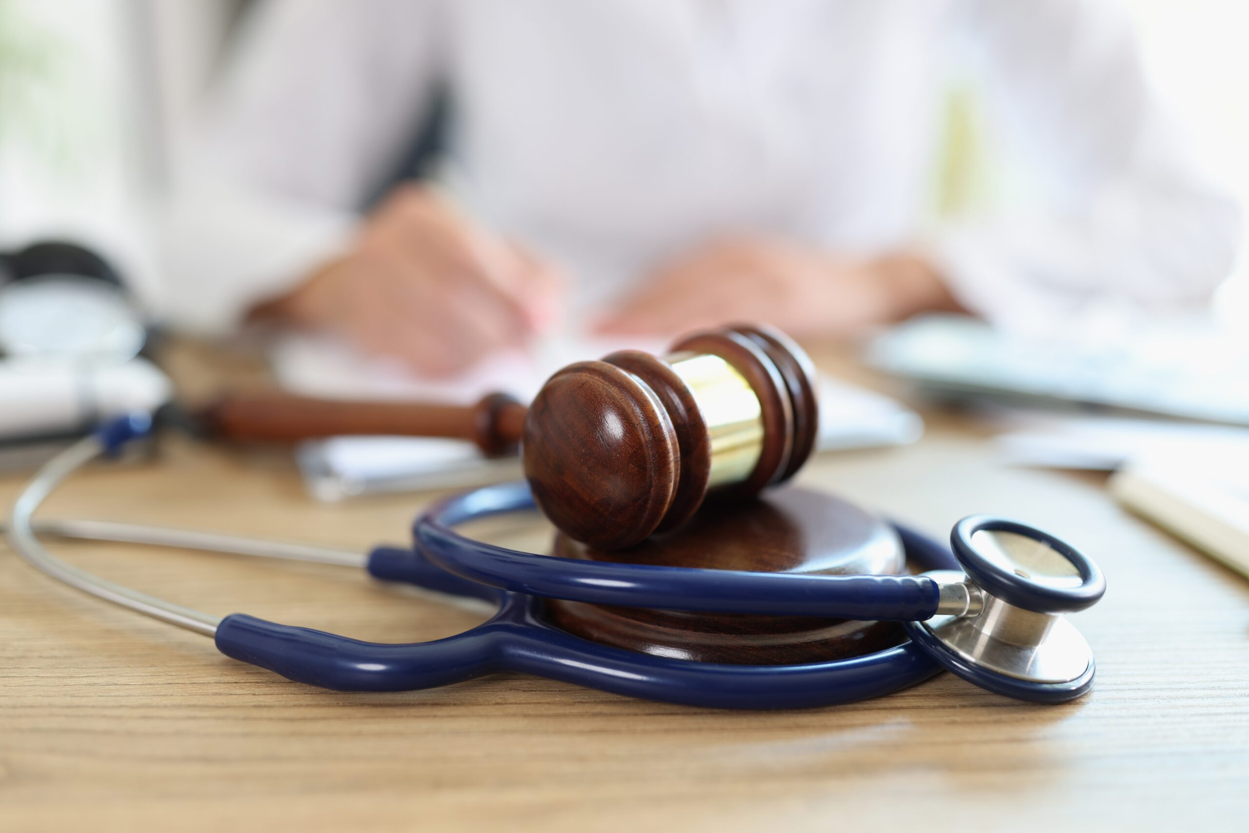 Close up,Of,Judge,Hammer,And,Doctor,Stethoscope,On,Office,Desk.