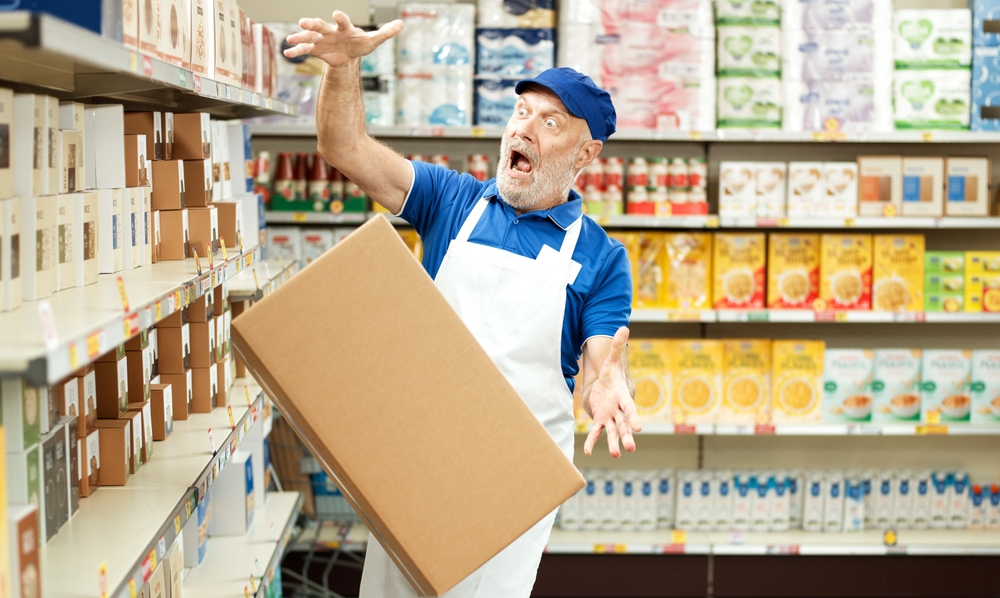 Clumsy,Stock,Clerk,Dropping,A,Big,Box,At,The,Supermarket